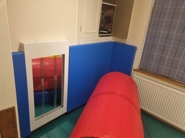 Custom designed soft padded room complete with bubble wall and activity tunnel