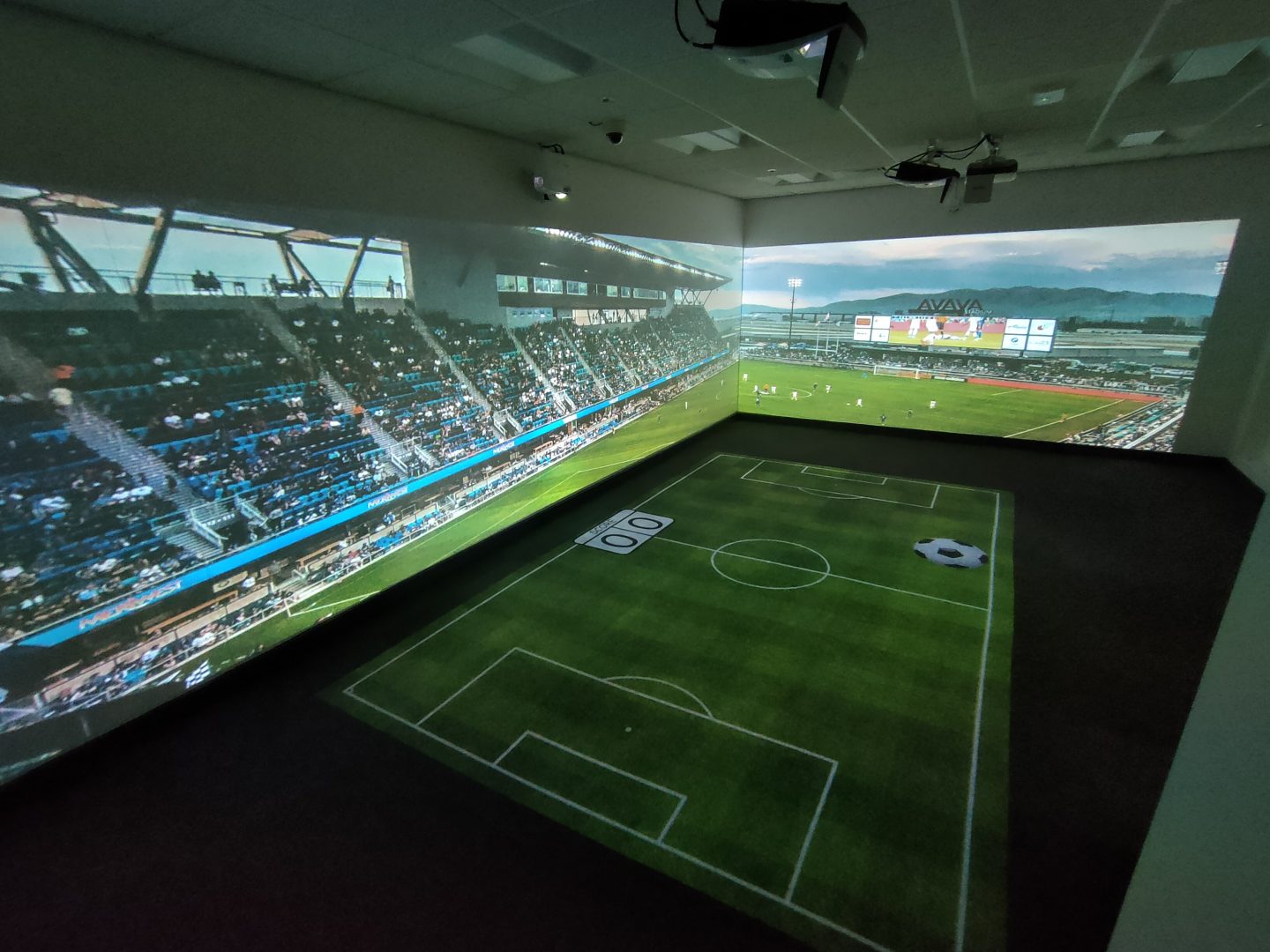 Immersive environment installed within a school. Interactive football on the floor and a non interactive football stadium is projected onto the walls
