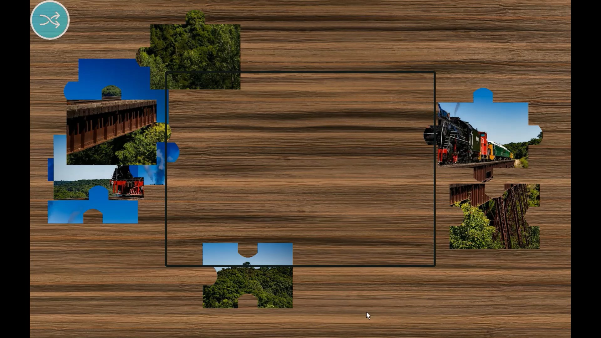 The Jigsaw activity, the image shows jigsaw pieces of a steam train, when the user touches the jigsaw pieces they arrange themselves in the correct place on the board.