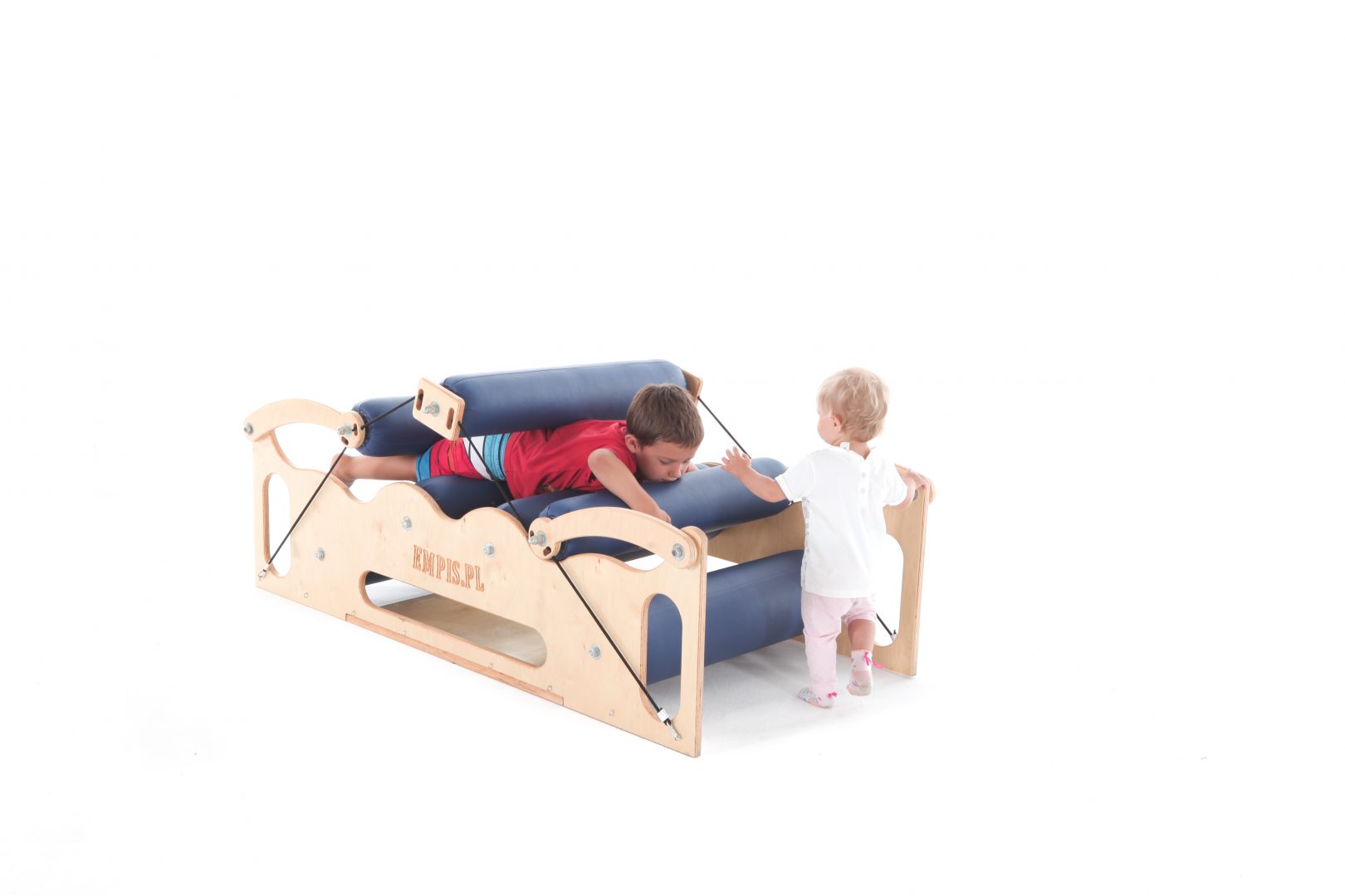 Large sensory body roller used in sensory integration featuring two children using the machine
