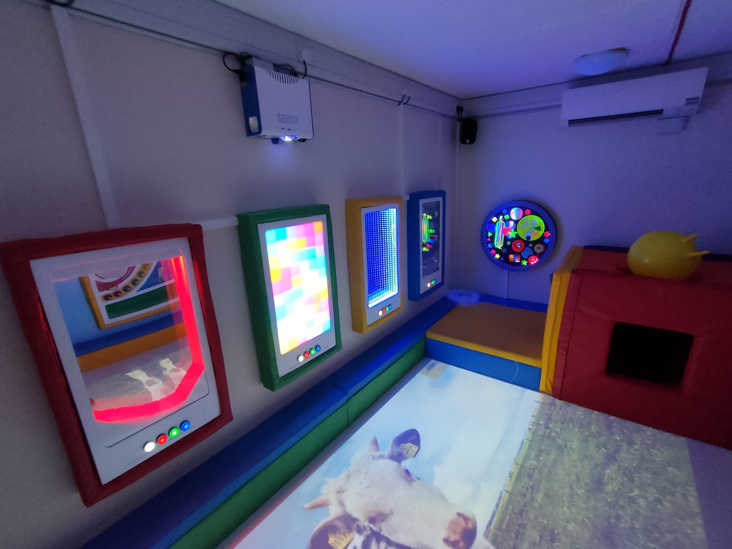 Sensory room featuring interactive wall panels, interactive floor and a soft padded den
