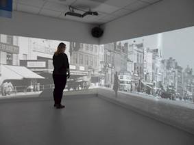 Immersive room showing a black and white image of a street